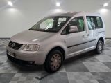 a picture of a silver van parked on a checkered floor