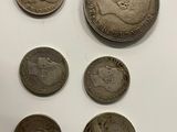 a close up of a bunch of coins sitting on top of a table