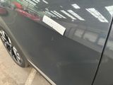 a sticker on the side of a black car