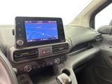 the dashboard of a car with a gps device in the center