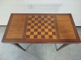 a wooden table with a chess board on it