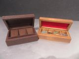 two wooden boxes that are sitting on a table