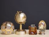 three different types of glass vases on a table