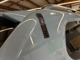 a close up of a plane in a hanger