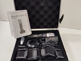 a black case with a set of hair brushes in it