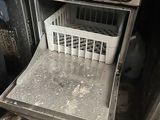 a dirty dishwasher inside of a dirty oven