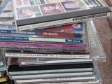 many cds stacked on top of each other on the floor