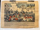 un vieux journal sur lequel figure la photo d'une scène de guerre