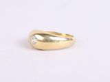 a gold ring with a single diamond in the middle