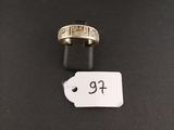 a gold ring with a price tag on top of it