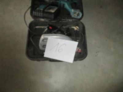a small piece of luggage with a note attached to it