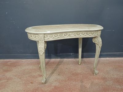 an antique console table with a carved top and ornate carvings on the legs