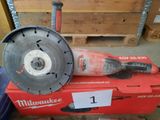a close up of a red box with a circular blade on top of it