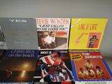 a lot of vinyl records on a table