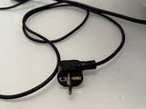 a black cord that is connected to a black plug