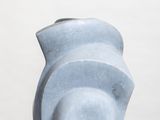 a blue vase sitting on top of a white pedestal