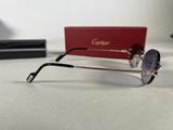 glasses are sitting on a table next to a red box