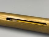 an image of a pen with a pencil in it sitting on a table