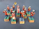 many figurines of men in uniform playing musical instruments