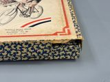 a box with a drawing of a man on a bicycle