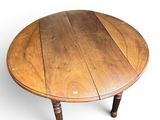 a round table with a wooden top on a white background