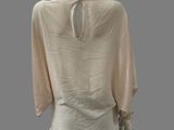 an image of a mannequin mannequin wearing a beige top