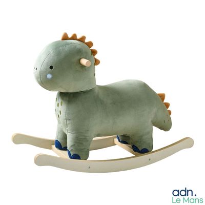 a stuffed animal that is sitting on a wooden rocking horse