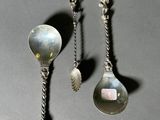 two spoons and a spoon on a table