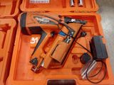 an orange box with a stapler and a stapler in it