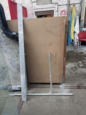 a pile of cardboard sitting on the ground in a garage