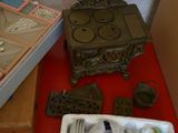 a red table with a box of silverware and a box of silverware