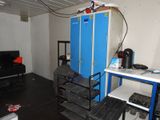 a computer desk with a laptop on top of it in a room