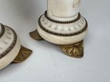 two candles that are sitting on top of each other