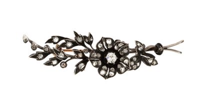 a close up of a black and white flower broochle