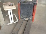 a fork lifter that is sitting in the garage