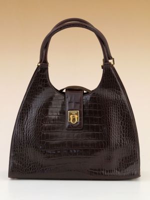 an image of a brown crocodile skin handbag on a white surface