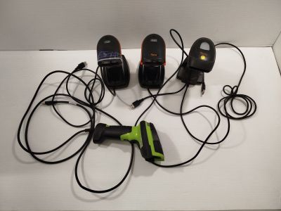 four different types of corded phones on a white surface