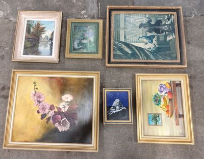 many framed pictures of flowers and vases on the floor