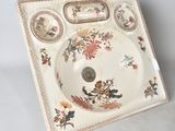 a white plate with a floral design on it
