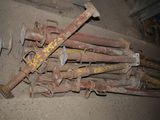 a pile of old rusted pipes and bolts on the ground