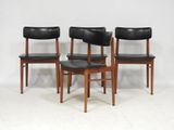 set of four danish teak dining chairs with black leather upholstered seats