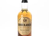 a bottle of knockando whisky on a white surface