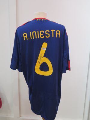 the shirt is blue and yellow with a number 6 on it