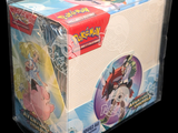 a box of pokemon trading cards on a black background