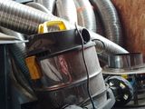 a vacuum that is sitting on top of a couch