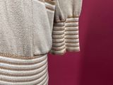 the back of a beige jacket on a mannequin mannequin mannequin mannequin mannequin mannequin mannequin mannequin