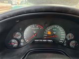 a close up of a car dashboard with a speedometer