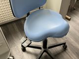 a blue office chair that is sitting on the floor