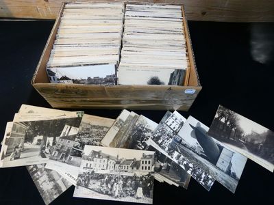 a lot of old black and white photos in a box