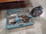 a blue tool case with tools in it sitting on the floor